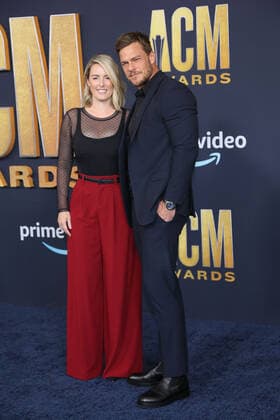 Catherine Ritchson and actor Alan Ritchson arrive for the 2022 Academy of Country Music Awards at Allegiant Stadium in Las Vegas, Nevada on Monday, March 7, 2022.  LAV20220307068 JAMESxATOA