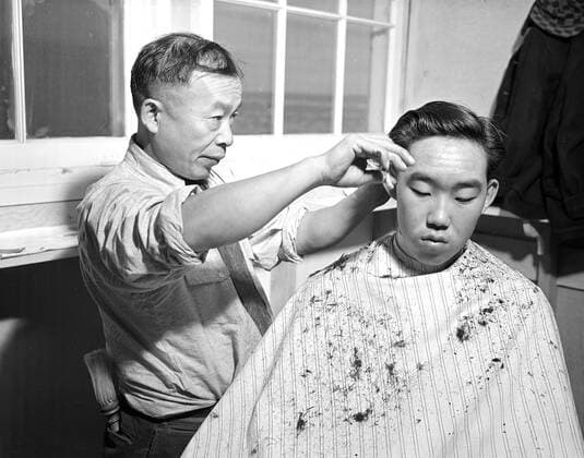 Minidoka Relocation Center. J. K. Kimura, Head barber. Ted Arai. Barber shop 12 10 1942 _ _ 1062_05_l_-7431-