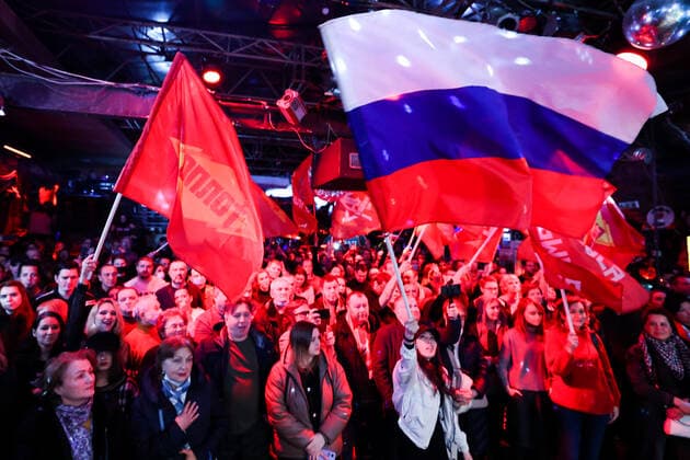 MOSCOW, RUSSIA â€“ MARCH 9, 2022: Spectators wave flags during a concert in support of the Russian Army and a special operation in Ukraine, at the Sexton club. Early on 24 February, Russia s President Putin announced his decision to launch a special military operation after considering requests from the leaders of the Donetsk People s Republic and Lugansk People s Republic. Vyacheslav Prokofyev TASS  TS1271D0