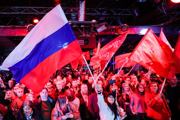 MOSCOW, RUSSIA â€“ MARCH 9, 2022: Spectators wave flags during a concert in support of the Russian Army and a special operation in Ukraine, at the Sexton club. Early on 24 February, Russia s President Putin announced his decision to launch a special military operation after considering requests from the leaders of the Donetsk People s Republic and Lugansk People s Republic. Vyacheslav Prokofyev TASS  TS1271E0