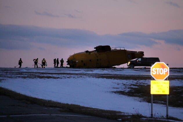 March 10, 2022, GANDER, NL, CANADA: Emergency crews work around the wreckage of a downed CH-149 Cormorant search and rescue helicopter at 9 Wing Canadian Forces Base Gander, in Gander, N.L., Thursday, March 10, 2022. The Royal Canadian Air Force says there were six crew members on board the CH-149 search and rescue helicopter when it went down this afternoon. GANDER CANADA  - ZUMAc35_ 20220310_zaf_c35_080 Copyright: xScottxCookx