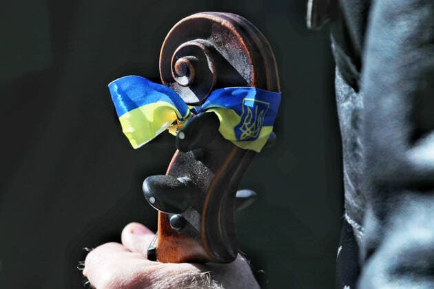 ODESA, UKRAINE - MARCH 12, 2022 - Ukrainian flag is seen on the cello fingerboard during the performance of the Symphony orchestra and choir of the Odesa National Academic Opera and Ballet Theater led by the conductor, Honored Artist of Ukraine Ihor Chernetskyi within the framework of the Free Sky concert in support of the appeal of the Ukrainian people and Ukrainian President Volodymyr Zelenskyy to the European and world countries to close the sky over Ukraine and stop the war, Odesa, southern Ukraine Free Sky concert held in Odesa  Copyright: xNinaxLyashonokx
