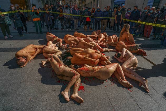 March 13, 2022, Madrid, Spain: (EDITOR s NOTE: Image contains profanity).Naked demonstrators covered in fake blood lie on Preciados street during a protest against the fur industry No Fur 2022 , in Madrid. The rally has been called as every year by the animal rights organization AnimaNaturalis to eradicate the use of animal fur in fashion and accessories. AnimalNaturalis was born to give a voice for animals that are used by humans for commercial purposes. Madrid Spain - ZUMAs197 20220313_zaa_s197_210 Copyright: xAtilanoxGarciax