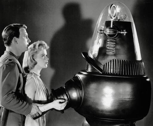 Leslie Nieilsen, Anne Francis, Robby the Robot, Forbidden Planet (1956) MGM. File Reference 34145-675THA  Copyright: xCinemaxLegacyxCollection ThexHollywoodxArchivex 34145-675THA