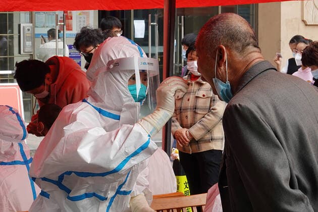 March 16, 2022, Changzhou, Jiangsu, China: A health worker wearing a Personal Protective Equipment (PPE) performs nucleic acid testing on a community resident in Changzhou. As of March 16, there were 253,944 covid-19 cases in China, including 233,096 in Hong Kong and 193 in Beijing. Changzhou China - ZUMAs197 20220316_zab_s197_019 Copyright: xSheldonxCooperx