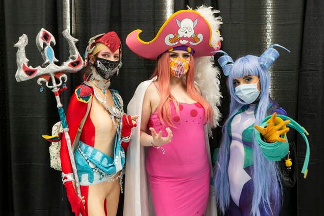 March 19, 2022, TORONTO, ON, CAN: From left to right, Susie cosplays as Mipha from Legend of Zelda, Katrina Primeau cosplays as Big Mom One Piece and Daddy denkiii cosplays as Nejrie Hado from My Hero Academia, at Toronto Comicon on Saturday , March 19, 2022. The event returns for the first time since 2019 due to COVID-19 restrictions. TORONTO CAN  - ZUMAc35_ 20220319_zaf_c35_079 Copyright: xChrisxYoungx