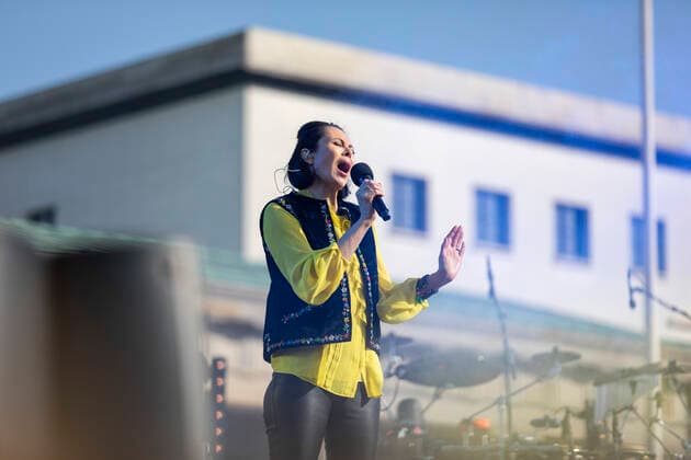 , Natalia Klitschko sings the song Better Day Berlin Berlin Germany on stage at the Brandenburg Gate at the Peace of Love concert with Daniel Leon