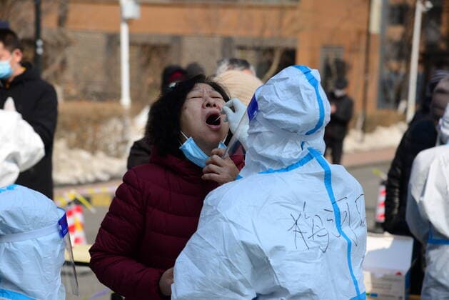 (220321) -- CHANGCHUN, March 21, 2022 -- A medical worker takes a swab sample from a resident for nucleic acid test at a COVID-19 testing site in Changchun, northeast China s Jilin Province, March 21, 2022. Changchun rolled out a new round of mass nucleic acid test on Sunday as a measure to combat the latest COVID-19 resurgence. ) CHINA-JILIN-CHANGCHUN-COVID-19-TEST(CN) ZhangxJian 
