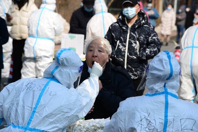 (220321) -- CHANGCHUN, March 21, 2022 -- A medical worker takes a swab sample from a resident for nucleic acid test at a COVID-19 testing site in Changchun, northeast China s Jilin Province, March 21, 2022. Changchun rolled out a new round of mass nucleic acid test on Sunday as a measure to combat the latest COVID-19 resurgence. ) CHINA-JILIN-CHANGCHUN-COVID-19-TEST(CN) ZhangxJian 