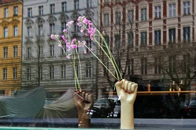 Flowers in the sea of houses shop window advertising in Rykestraße in Berlin Prenzlauer Berg Berlin Prenzlauer Berg Berlin Germany