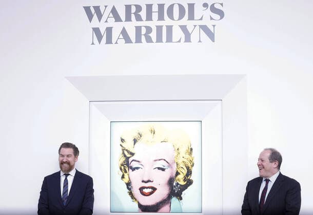 Chairman of Christie s Americas Marc Porter and Christie s Chairman of 20th and 21st Century Art Alex Rotter stand with Shot Sage Blue Marilyn by Andy Warhol which is on display after an announcement that it will go up for Auction at Christie s on Monday, March 21, 2022 in New York City. The iconic Andy Warhol silk-screen portrait of Hollywood starlet Marilyn Monroe is on the block for $200 million, a record asking price for any 20th Century painting.  NYP20220321105 JohnxAngelillo