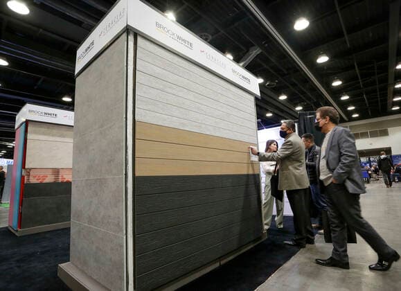 (220323) -- VANCOUVER, March 23, 2022 -- People look at wall construction materials during the 2022 BUILDEX show in Vancouver, British Columbia, Canada, on March 23, 2022. As one of Canada s largest conferences and trade shows for building industry, the 2022 BUILDEX Vancouver kicked off on Wednesday, showcasing the latest building materials, products and technologies. (Photo by Xinhua) CANADA-VANCOUVER-2022 BUILDEX SHOW LiangxSen 