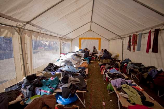 Migrant crisis in Briancon (French Alps, south-eastern France): migrants arriving from Italy welcomed by the parish of Sainte-Catherine (2021 11 05) Briancon (French Alps, south-eastern France), November 5, 2021: exiles eating under the tent which also serves as a men™s dormitory. Reportage at St Catherine s Church on migrants who crossed the border of Montgenevre between Italy and France. The parish of Sainte-Catherine offered an emergency accommodation with makeshift beds to hundreds of migrants. Since October 24, the associative refuge which offered them a cottage has closed, faced with arrivals that surpass its capacity PACA; Hautes Alpes 05; Briancon Europe; Western Europe; France  Copyright: xDurandxT Alpaca Andia.frx 394061
