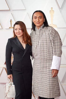 Pawo Choyning Dorji and guest arrive on the red carpet of the 94th OscarsÂ® at the Dolby Theatre at Ovation Hollywood in Los Angeles, CA, on Sunday, March 27, 2022.  Copyright: xx 34342-146THA