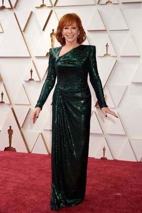 Reba McEntire arrives on the red carpet of the 94th OscarsÂ® at the Dolby Theatre at the Ovation Hollywood in Los Angeles, CA, on Sunday, March 27, 2022.  Copyright: xx 34342-322THA