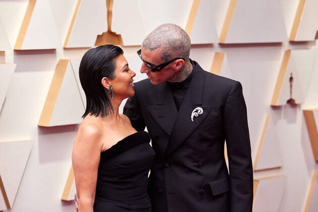Kourtney Kardashian and Travis Barker arrive on the red carpet of the 94th OscarsÂ® at the Dolby Theatre at Ovation Hollywood in Los Angeles, CA, on Sunday, March 27, 2022.  Copyright: xx 34342-579THA