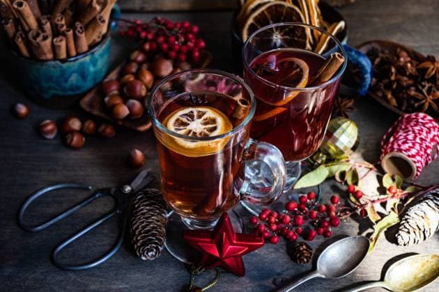 Milled or spiced wine or Gluehwein with oranges, anise star, cinnamon and berries on rustic wooden table with copy space, model released, , property released, , 33529532.jpg, Gluehwein, alcohol, anise star, card, ceramic, christmas, cinnamon, cold, concept, copy space, cup, festive, food, frame, glass, holiday, ingredient, merry christmas, mood, moody, mug, mulled, nut, orange, red berry, ribbon, rope, rustic, season, seasonal, spice, stick, variety, vintage, winter, wooden, xmas,