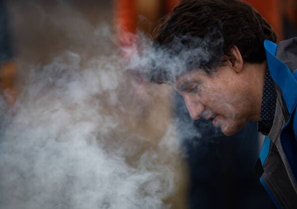 March 30, 2022, WILLIAMS LAKE, BC, CANADA: Smoke rises as Prime Minister Justin Trudeau helps Williams Lake First Nation Chief Willie Sellars start a ceremonial fire on the former grounds of St. Josephs Mission Residential School, in Williams Lake, B.C., on Wednesday, March 30, 2022. In January, the Williams Lake First Nation announced it had identified 93 reflections that could indicate the number of children buried around the site of the former residential school. WILLIAMS LAKE CANADA - ZUMAc35_ 20220330_zaf_c35_108 Copyright: xDarrylxDyckx
