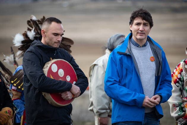March 30, 2022, WILLIAMS LAKE, BC, CANADA: Prime Minister Justin Trudeau speaks as Williams Lake First Nation Chief Willie Sellars, left, listens during a visit to the former grounds of St. Joseph s Mission Residential School, in Williams Lake, B.C., on Wednesday, March 30, 2022. In January, the Williams Lake First Nation announced it had identified 93 reflections that could indicate the number of children buried around the site of the former residential school. WILLIAMS LAKE CANADA - ZUMAc35_ 20220330_zaf_c35_114 Copyright: xDarrylxDyckx