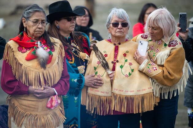 March 30, 2022, WILLIAMS LAKE, BC, CANADA: Women listen as Prime Minister Justin Trudeau speaks during a visit to the former grounds of St. Joseph s Mission Residential School, in Williams Lake, B.C., on Wednesday, March 30, 2022. In January, the Williams Lake First Nation announced it had identified 93 reflections that could indicate the number of children buried around the site of the former residential school. WILLIAMS LAKE CANADA - ZUMAc35_ 20220330_zaf_c35_116 Copyright: xDarrylxDyckx