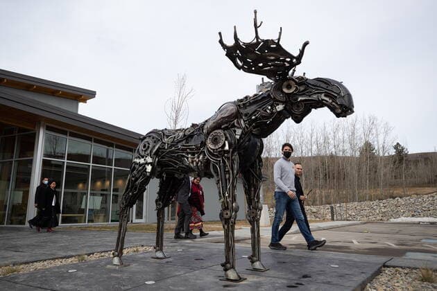 March 30, 2022, WILLIAMS LAKE, BC, CANADA: Prime Minister Justin Trudeau and Williams Lake First Nation Chief Willie Sellars, back right, walk past a sculpture of a moose as they arrive for a news conference, in Williams Lake, B.C., on Wednesday, March 30, 2022. WILLIAMS LAKE CANADA - ZUMAc35_ 20220330_zaf_c35_122 Copyright: xDarrylxDyckx