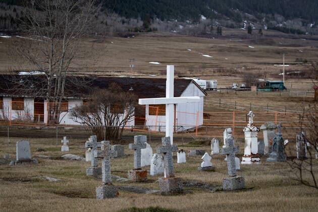 March 30, 2022, WILLIAMS LAKE, BC, CANADA: A cemetery and a boarded up abandoned building are seen on the former grounds of St. Joseph s Mission Residential School, in Williams Lake, B.C., on Wednesday, March 30, 2022. In January, the Williams Lake First Nation announced it had identified 93 reflections that could indicate the number of children buried around the site of the former residential school. WILLIAMS LAKE CANADA - ZUMAc35_ 20220330_zaf_c35_133 Copyright: xDarrylxDyckx