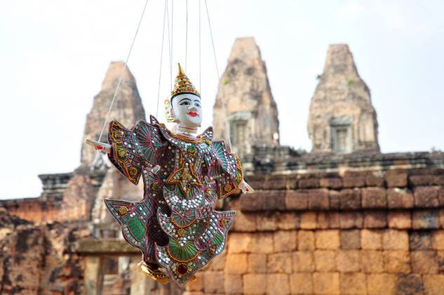 Marionette at Angkor Cambodia,a jointed puppet manipulated from above by strings attached to its limbs. , 2326121.jpg, cambodia, angkor, travel, architecture, old, ancient, khmer, asia, bayon, buddhism, face, history, tourism, religious, culture, religion, historic, buddha, sculpture, buddhist, asian, cambodian, civilization, famous, southeast, puppet, souvenir, toy, image, vivid, nice, ruins, blur, background,