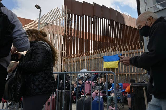 April 1, 2022, Tijuana, Baja California, Mexico: Registered Ukrainian refugees wait at the San Ysidro Port of Entry to cross into the United States for asylum, under the Biden AdministrationÃ¢â‚¬â ¢s recent proclamation of allowing 100,000 refugees though Temporary Protected Status in Tijuana, Mexico on Friday. Tijuana Mexico - ZUMAm180 20220401_zip_m180_004 Copyright: xCarlosxA.xMorenox