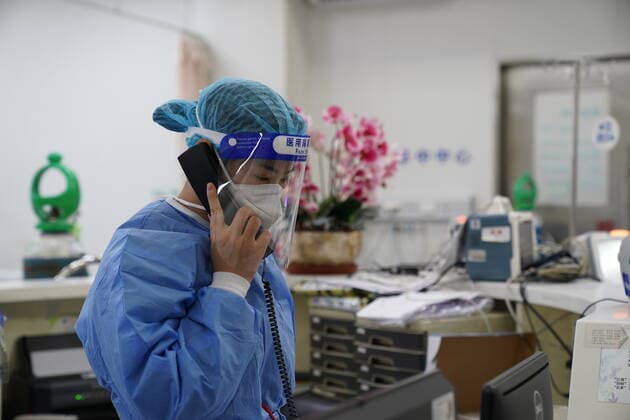 (220402) -- SHANGHAI, April 2, 2022 -- A nurse answers a call to get ready for incoming patients at the emergency center of Ruijin Hospital in east China s Shanghai, April 1, 2022. Ruijin Hospital has been optimizing its emergency services amid the latest COVID-19 resurgence in Shanghai. More personnel have been assigned to reinforce the emergency capability. ) CHINA-SHANGHAI-HOSPITAL-EMERGENCY CENTER (CN) YuanxQuan 