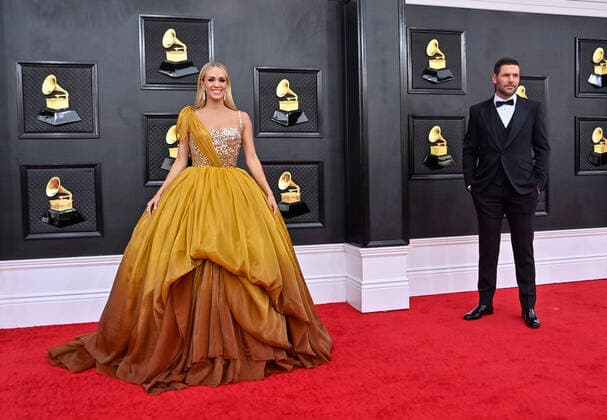 Carrie Underwood and Mike Fisher arrive for the 64th annual Grammy Awards at the MGM Grand Garden Arena in Las Vegas, Nevada on Sunday, April 3, 2022.  LAV20220403612 JIMxRUYMEN