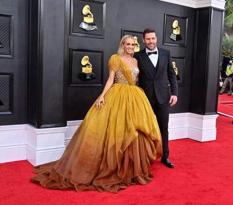Carrie Underwood and Mike Fisher arrive for the 64th annual Grammy Awards at the MGM Grand Garden Arena in Las Vegas, Nevada on Sunday, April 3, 2022.  LAV20220403616 JIMxRUYMEN