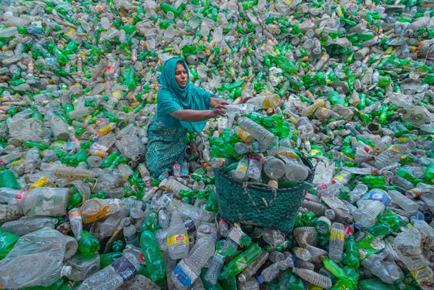 April 4, 2022, Noakhali, Chittagong, Bangladesh: A worker is sorting used plastic bottles in a recycling factory in Noakhali, Bangladesh. Plastic bottles used to package water take over 1,000 years to biodegrade and, if incinerated, produce toxic fumes. Floating plastic waste, which can survive for thousands of years in water, serves as mini transportation devices for invasive species, disrupting habitats. Plastic buried deep in landfills can leach harmful chemicals that spread into groundwater. So, Recycling of plastics is the best way to make the environment safe. Recycling reduces the pollution that can come from the chemicals used to make these bottles. It also helps cut down on the amount of trash thrown into landfills so our garbage d - ZUMAs231 20220404_zip_s231_009 Copyright: xJoyxSahax