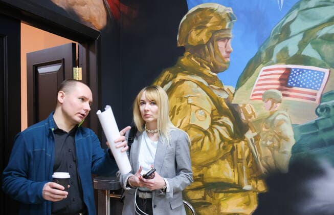 MOSCOW, RUSSIA - APRIL 4, 2022: People attend the exhibition NATO: The Chronicle of Cruelty at the State Central Museum of Contemporary History of Russia. Anton Novoderezhkin TASS  TS12B010