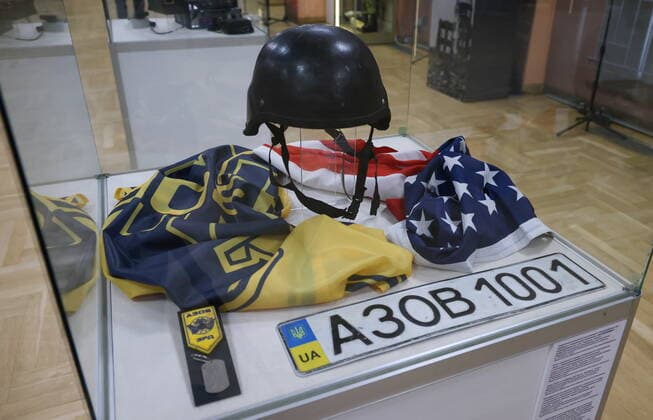 MOSCOW, RUSSIA - APRIL 4, 2022: A protective helmet of the Armed Forces of Ukraine with an SS emblem is on display at the exhibition NATO: The Chronicle of Cruelty at the State Central Museum of Contemporary History of Russia. Anton Novoderezhkin TASS  TS12B022