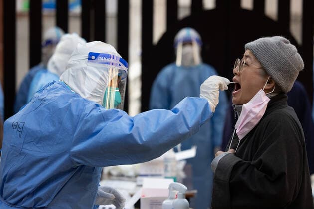 (220404) -- SHANGHAI, April 4, 2022 -- A medical worker from east China s Anhui Province takes a swab sample from a resident for nucleic acid test at a community in Huangpu District of Shanghai, east China, April 4, 2022. Amid rising numbers of COVID-19 infections in its latest resurgence, Shanghai on Monday launched a citywide nucleic acid testing campaign covering the city s more than 24 million residents. ) CHINA-SHANGHAI-COVID-19-CITYWIDE TESTING (CN) JinxLiwang 