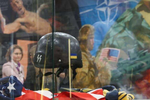 MOSCOW, RUSSIA - APRIL 4, 2022: A protective helmet of the Armed Forces of Ukraine with an SS emblem is on display at the exhibition NATO: The Chronicle of Cruelty at the State Central Museum of Contemporary History of Russia. Anton Novoderezhkin TASS  TS12B03F