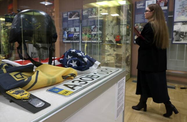 MOSCOW, RUSSIA - APRIL 4, 2022: A protective helmet of the Armed Forces of Ukraine with an SS emblem is on display at the exhibition NATO: The Chronicle of Cruelty at the State Central Museum of Contemporary History of Russia. Anton Novoderezhkin TASS  TS12B061