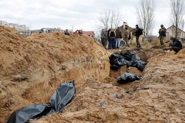 April 4, 2022, Bucha, Bucha, Ukraine: Dozens of corpses of Ukrainians are buried in a mass grave behind a church in Bucha, a town recently recaptured by the Ukrainian forces, as the Russian are said to have killed hundreds of civilians in the town. There have been International accusations of Russia committing war crimes since the beginning of the invasion of Ukraine. Bucha Ukraine - ZUMAs313 20220404_zip_s313_004 Copyright: xDanielxCengxShou-Yix