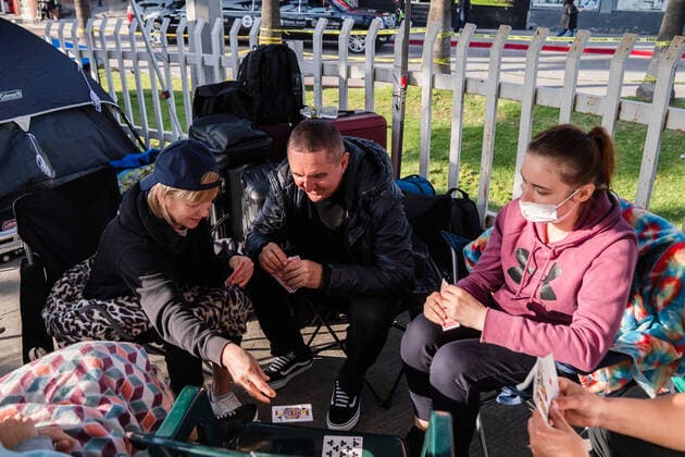 Ukrainians who fled to Mexico amid Russia s invasion of Ukraine wait near the San Ysidro Port of Entry of the U.S.-Mexico border on Monday, April 4, 2022 in Tijuana, Mexico. The refugees are given a number so they do not have to wait in line as the United States said they will accept 100,000 Ukrainian refugees due to the Russian invasion of Ukraine.  MEX2022040419 ARIANAxDREHSLER
