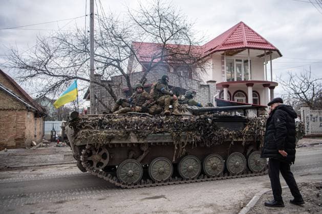 April 6, 2022, Irpin, Ukraine: A Ukrainian tank carrying soldiers drives down a road in Irpin, a town near Kyiv recently liberated from Russian occupation. Russia invaded Ukraine on 24 February 2022, triggering the largest military attack in Europe since World War II. Irpin Ukraine - ZUMAs197 20220406_zaa_s197_325 Copyright: xLaurelxChorx