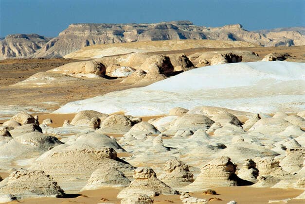 Creative Highlights World Desert landscape with formations , 9915728.jpg, Desolate, Eroding, Arid, Desert, Mountain range, Landforms, Outdoors, Nobody, Photography, aridness, aridity, arid climate, Dry, dryness, mountainside, mountain chain, Mountain, outside, topographical, topographic, topography, nature, Natural world, erosive, eroded, erode, erosion, lifeless, barren, desolation, deserted, bleak, Mountains,