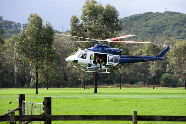 WET WEATHER DEATH NSW, A NSW PolAir helicopter crew are seen at Cobbity, south west of Sydney, Friday, April 8, 2022. A 68 year old man was found in a submerged van around 8am Friday. ( NO ARCHIVING, EDITORIAL USE ONLY, NO USE IN BOOKS WITHOUT CONSENT SYDNEY NSW AUSTRALIA  Copyright: xDANxHIMBRECHTSx 20220408001644877622