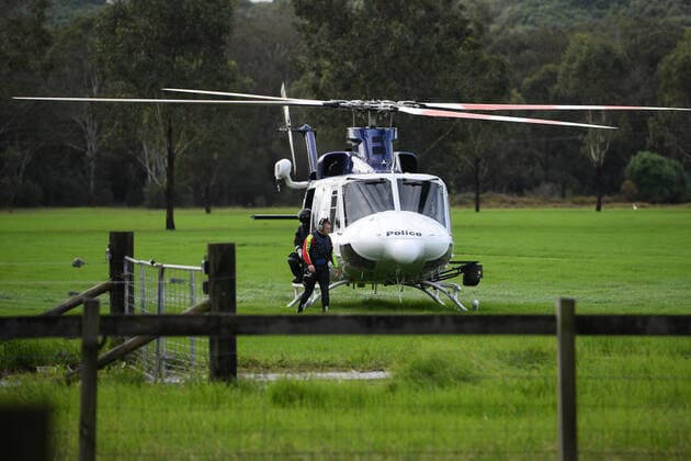 WET WEATHER DEATH NSW, A NSW PolAir helicopter crew are seen at Cobbity, south west of Sydney, Friday, April 8, 2022. A 68 year old man was found in a submerged van around 8am Friday. ( NO ARCHIVING, EDITORIAL USE ONLY, NO USE IN BOOKS WITHOUT CONSENT SYDNEY NSW AUSTRALIA  Copyright: xDANxHIMBRECHTSx 20220408001644877646