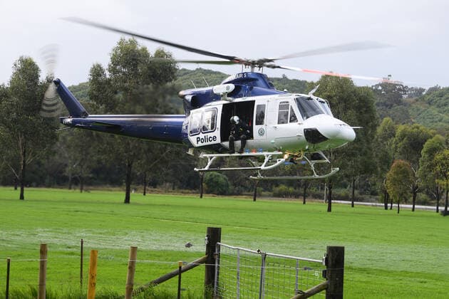 WET WEATHER DEATH NSW, A NSW PolAir helicopter crew are seen at Cobbity, south west of Sydney, Friday, April 8, 2022. A 68 year old man was found in a submerged van around 8am Friday. ( NO ARCHIVING, EDITORIAL USE ONLY, NO USE IN BOOKS WITHOUT CONSENT SYDNEY NSW AUSTRALIA  Copyright: xDANxHIMBRECHTSx 20220408001644877670