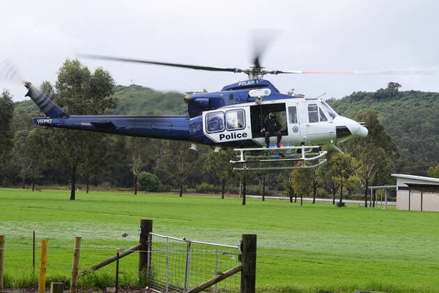 WET WEATHER DEATH NSW, A NSW PolAir helicopter crew are seen at Cobbity, south west of Sydney, Friday, April 8, 2022. A 68 year old man was found in a submerged van around 8am Friday. ( NO ARCHIVING, EDITORIAL USE ONLY, NO USE IN BOOKS WITHOUT CONSENT SYDNEY NSW AUSTRALIA  Copyright: xDANxHIMBRECHTSx 20220408001644877718