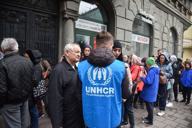 March 31, 2022, Lviv, Ukraine: An employee of the UN Refugee Office in Lviv advises people who want to register as refugees due to the Russian military invasion of Ukraine. The UN Office for Refugees, which registers refugees from Russian military aggression in Ukraine, has opened in Lviv. Each refugee will receive 2,200 hryvnias (equivalent to $ 80) from the UN each month for three months. Currently, such offices operate only in three Ukrainian cities - Lviv, Uzhhorod, and Mukachevo. Lviv Ukraine - ZUMAs197 20220331_zab_s197_101 Copyright: xPavloxPalamarchukx