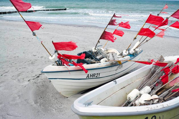 Small boats of coastal fishing lie on the beach in the Baltic resort of Ahrenshoop Ahrenshoop Copyright: FrankxHormannx xnordlicht