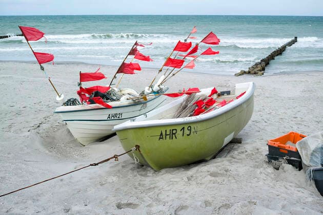 Small boats of coastal fishing lie on the beach in the Baltic resort of Ahrenshoop Ahrenshoop Copyright: FrankxHormannx xnordlicht