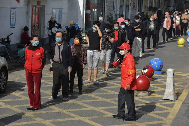 April 8, 2022, Fuyang, China: Residents wearing face masks wait in a line to be tested for COVID-19 nucleic acid in Fuyang. On April 8, 2022, there were more than 270,000 confirmed COVID-19 cases in China, and more than 150,000 asymptomatic COVID-19 cases, with more than 4,000 confirmed COVID-19 cases in Shanghai and more than 20,000 new asymptomatic COVID-19 cases. Fuyang China - ZUMAs197 20220408_zab_s197_044 Copyright: xSheldonxCooperx