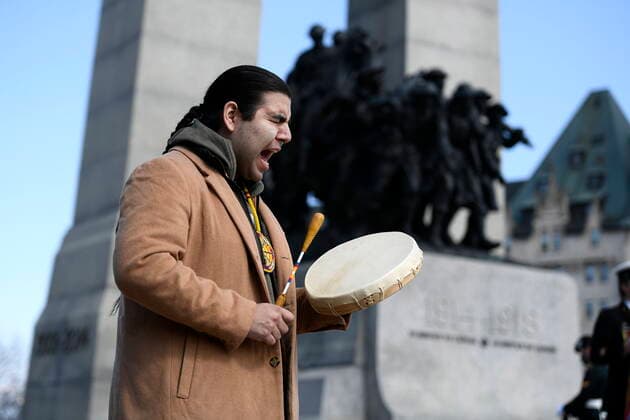 April 9, 2022, Ottawa, ON, CAN: Awema Tendesi sings an honour song during a ceremony commemorating the 105th anniversary of the Battle of Vimy Ridge, at the National War Memorial in Ottawa, on Saturday, April 9, 2022. Ottawa CAN  - ZUMAc35_ 20220409_zaf_c35_011 Copyright: xJustinxTangx